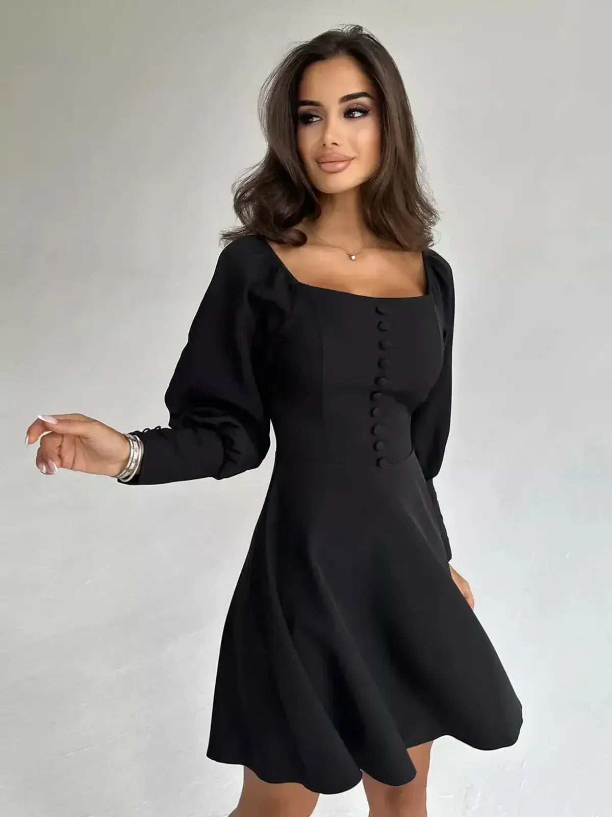 Noir Aura Mini Dress - a chic black mini dress with button-down detail and voluminous long sleeves, perfect for formal occasions.