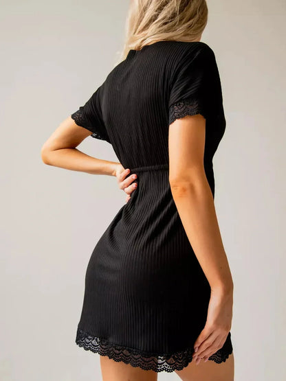 Black mini dress with ribbed texture and lace trim, perfect for summer dresses, cocktail events, and evening wear.