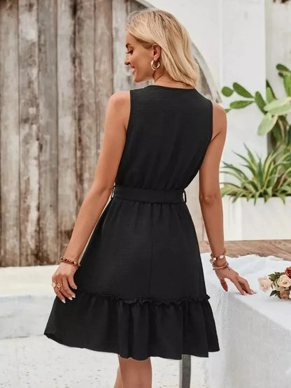 Back view of a stylish black mini dress with tie-waist belt and flared hem, perfect for summer and cocktail occasions.