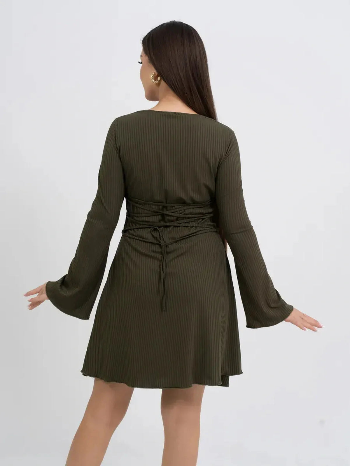 Back view of Olive Muse long sleeve mini dress in olive green with flared sleeves and a cinched waist for a flattering look.