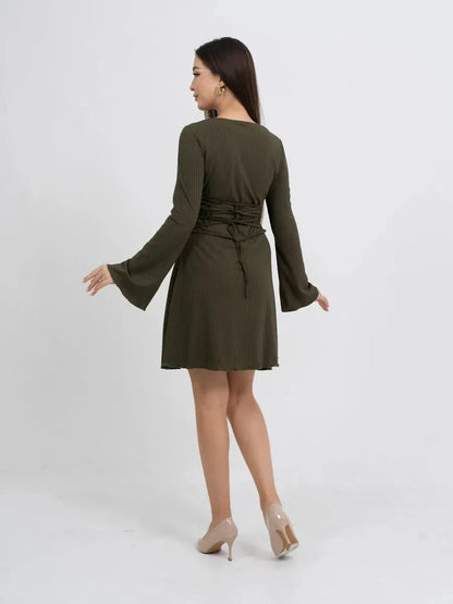 Back view of a long sleeve olive green mini dress featuring a relaxed fit and flared bell sleeves.