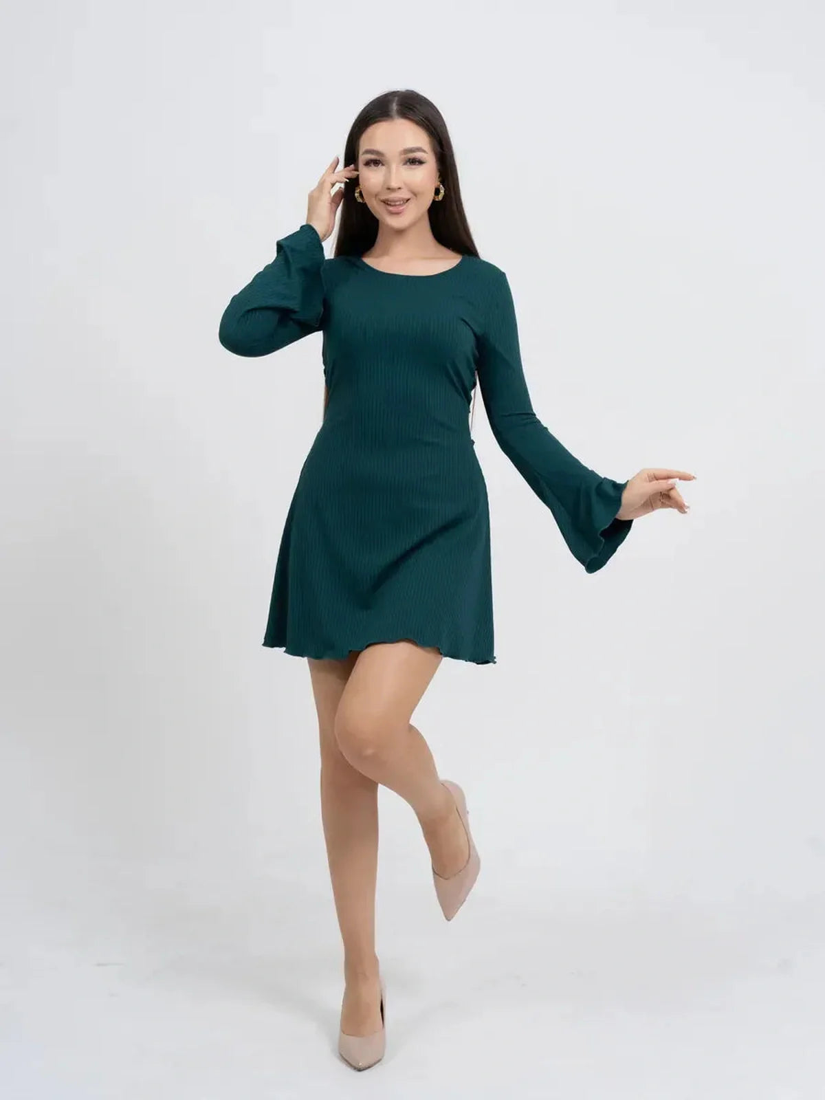Model in a green long sleeve mini dress with bell sleeves, perfect for summer parties and formal events.