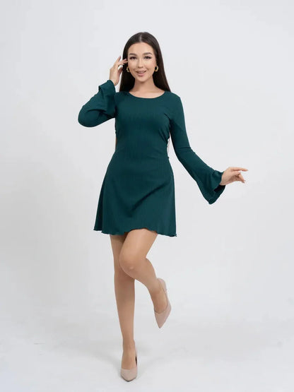 Model in a green long sleeve mini dress with bell sleeves, perfect for summer parties and formal events.