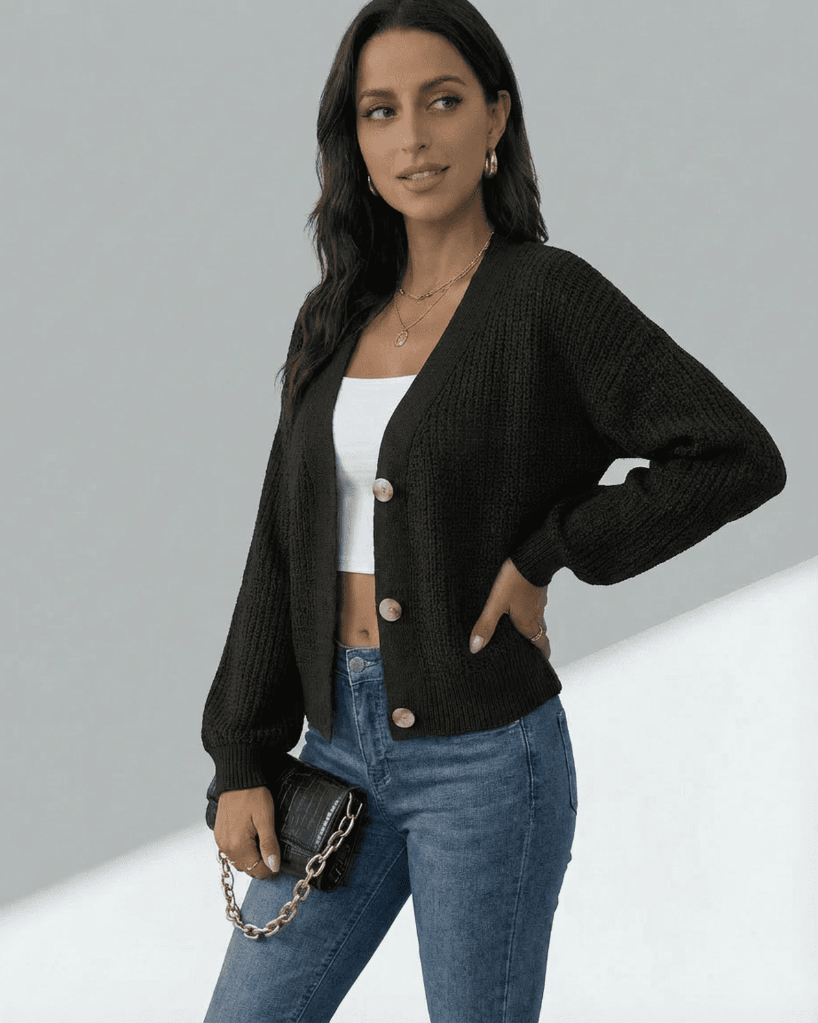 Model showcasing the Orion Cardigan by Slimona, featuring a V-neckline and button-front design.