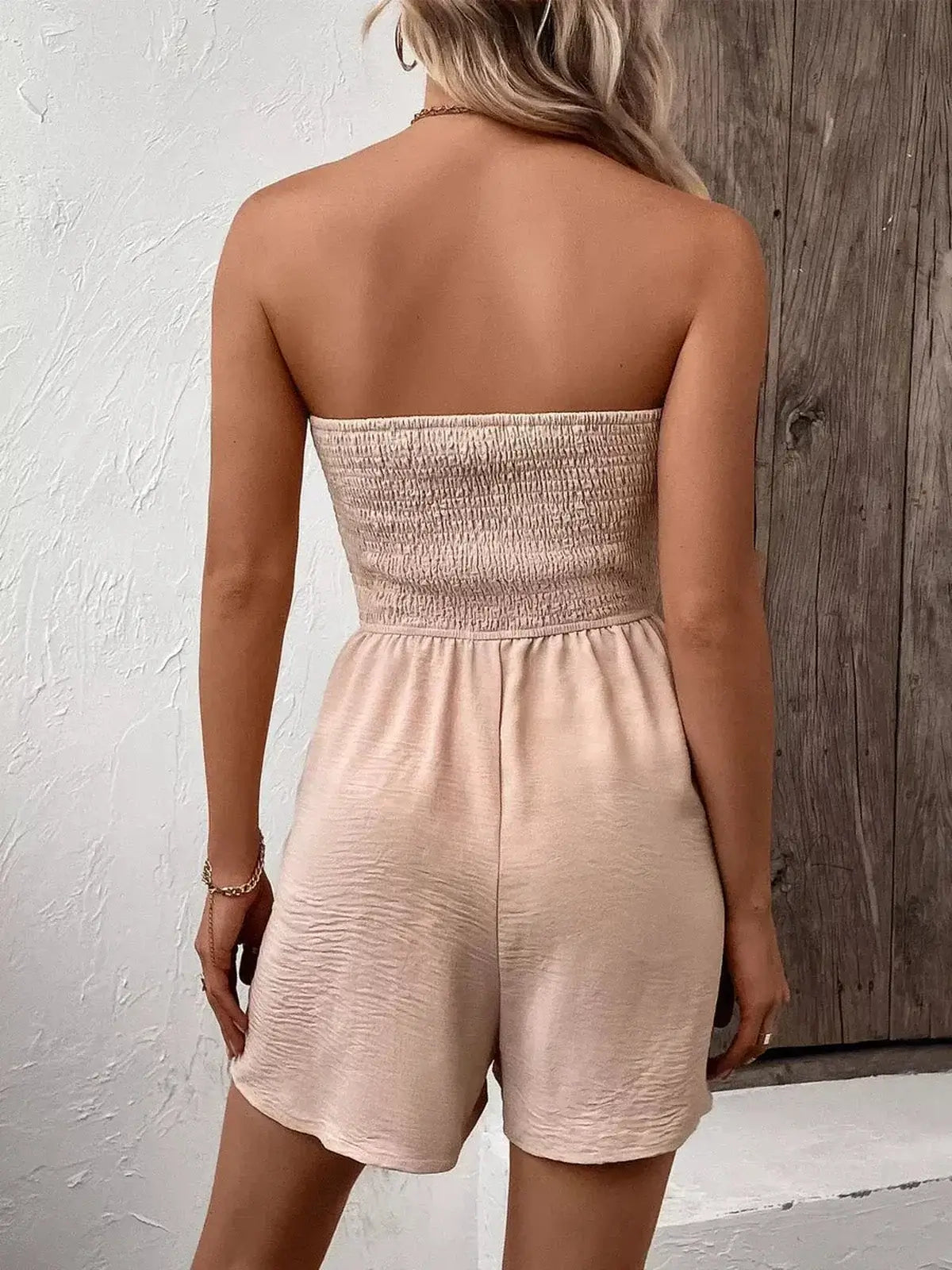 Back view of a strapless Palm Bay mini dress featuring a shirred bodice and lightweight fabric, perfect for summer.