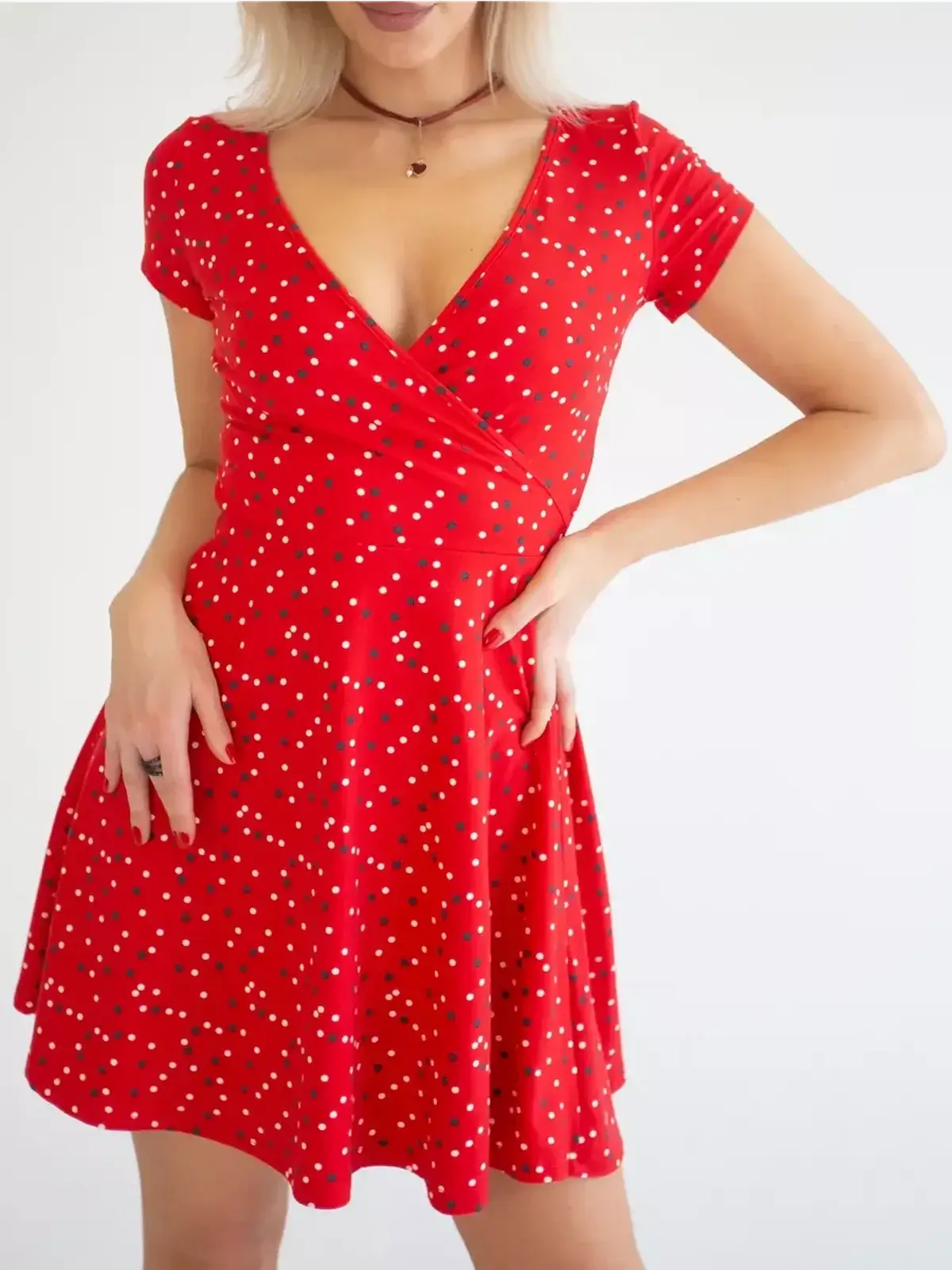 Red polka dot mini dress with V-neckline, perfect for summer, weddings, or parties.