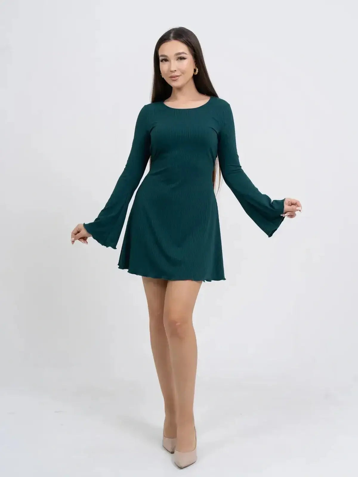 Model showcasing a long sleeve mini dress in teal with flared sleeves, ideal for summer parties or as a wedding guest dress.