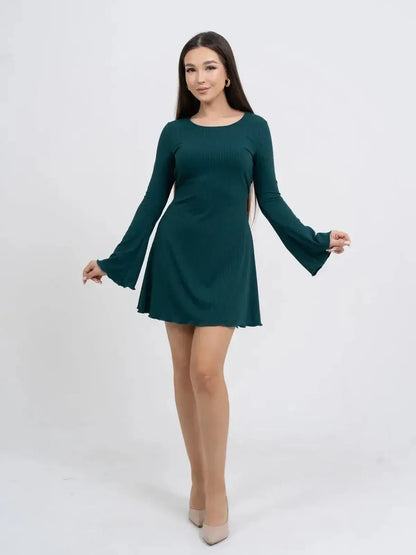 Model showcasing a long sleeve mini dress in teal with flared sleeves, ideal for summer parties or as a wedding guest dress.