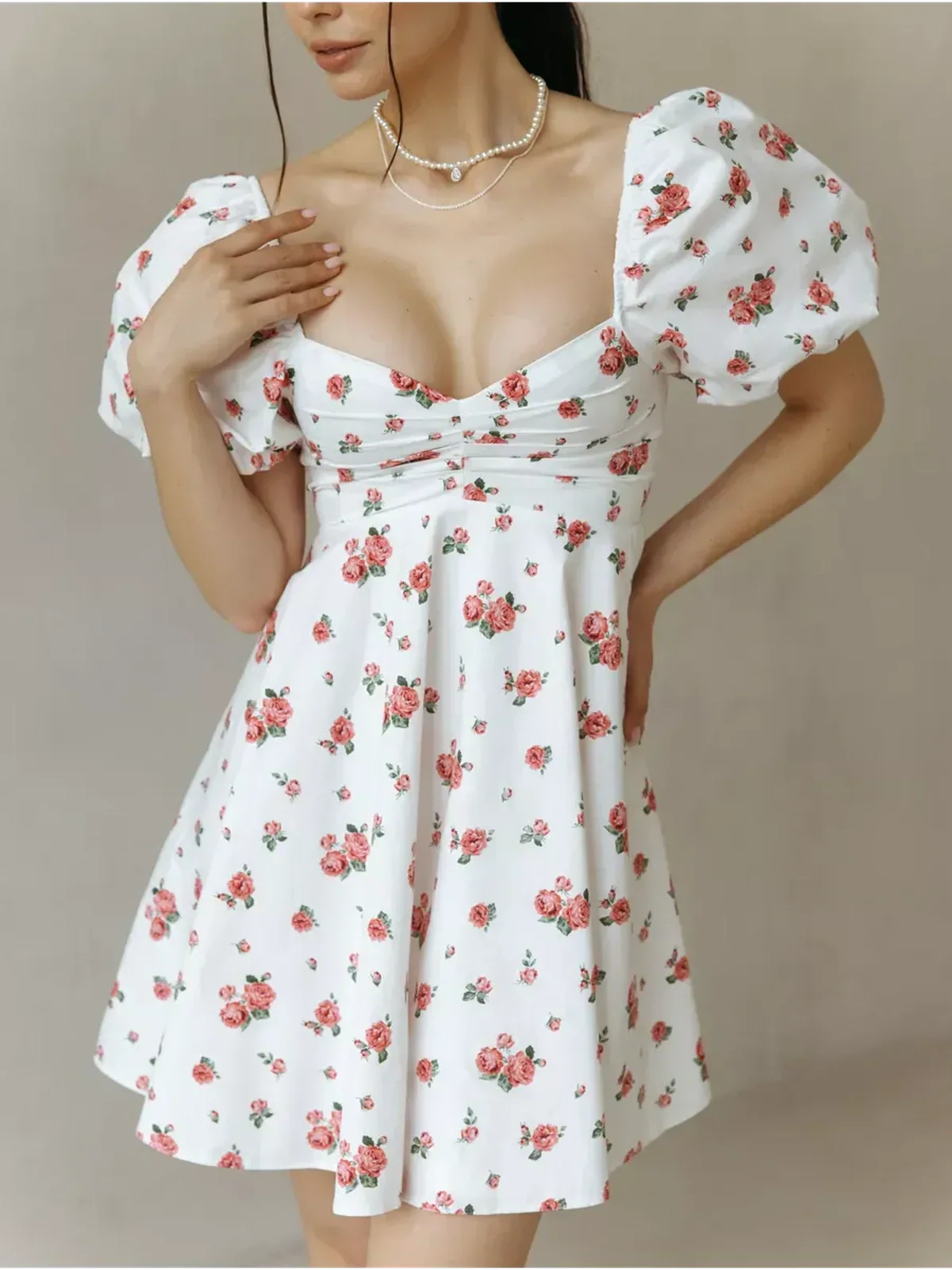 Rosabelle Mini Dress with floral print, sweetheart neckline, and puff sleeves, perfect for summer weddings and parties.