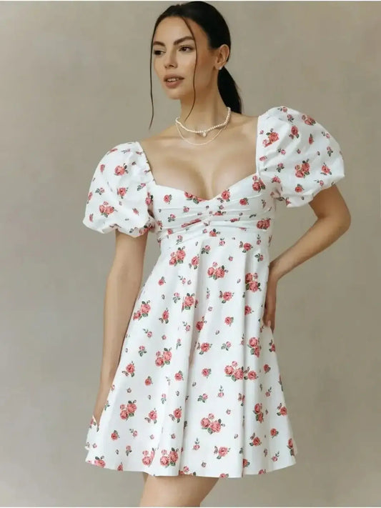 Floral Rosabelle Mini Dress featuring a sweetheart neckline and puff sleeves, perfect for summer or wedding guests.