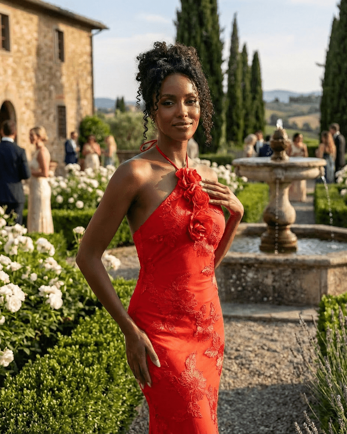 Rosalia Maxi Dress by Slimona, displaying a model in a bold red halter neck dress with 3D floral details in a scenic garden.