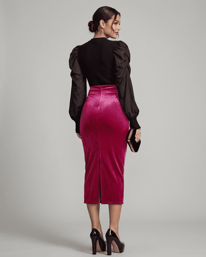 Elegant woman in Rosalia Midi Skirt by Slimona, showcasing velvet texture and back slit details.