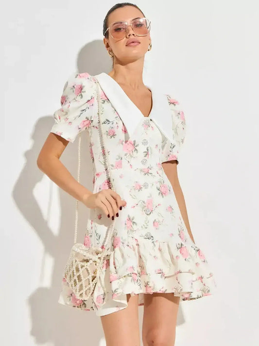 Floral Rose Charm mini dress with puffed sleeves and flared hem, perfect for summer weddings and parties.