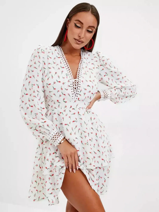 Elegant white mini dress with rosebud print, perfect for summer parties and weddings.