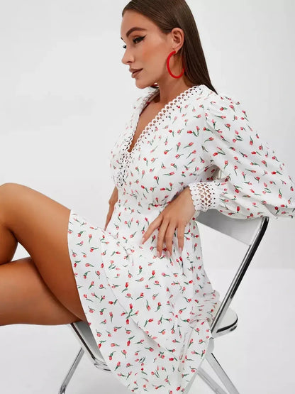 Elegant white mini dress with rosebud print, perfect for summer parties and bridal events.