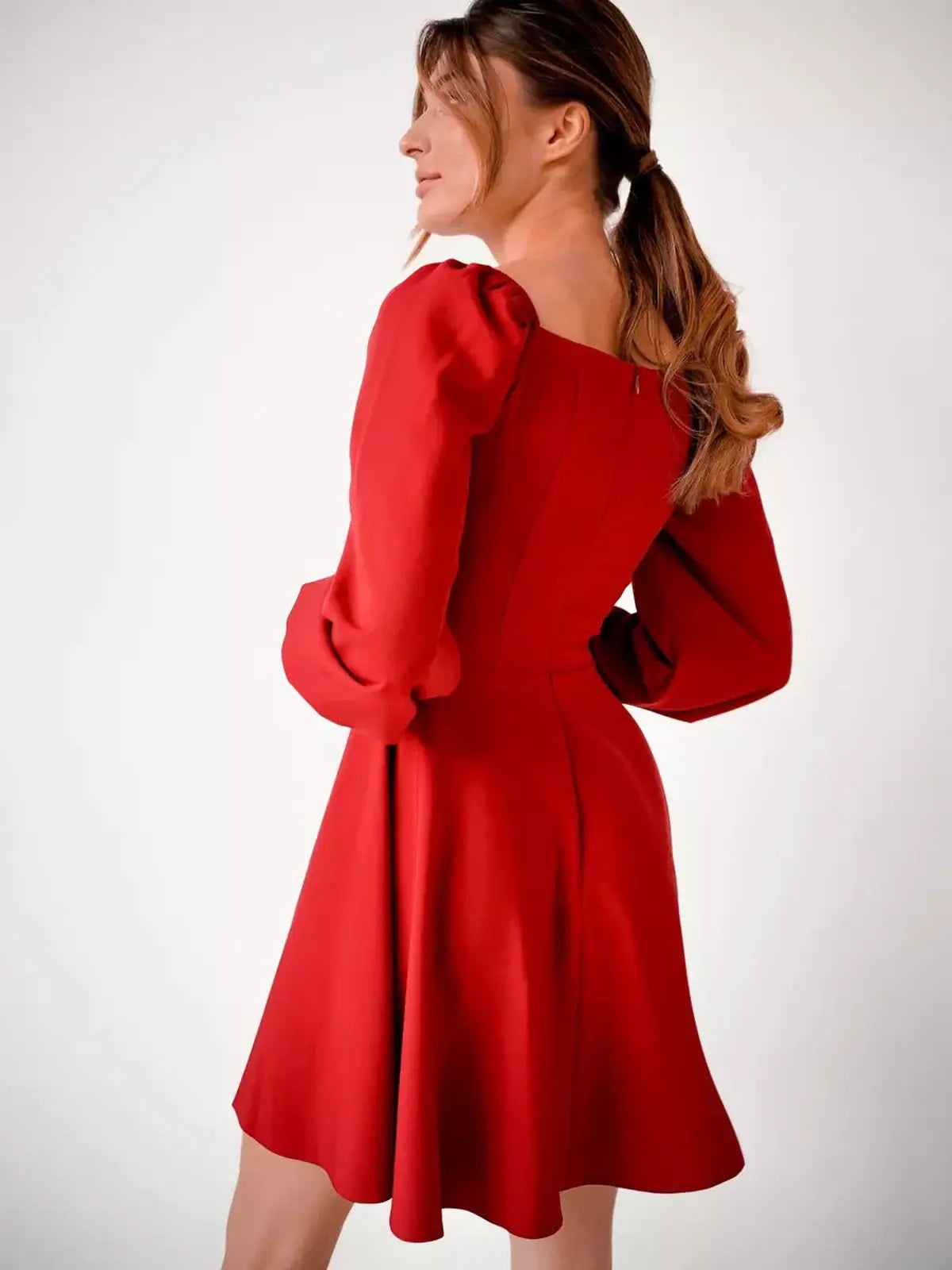 Stylish red mini dress with puff sleeves, flared skirt, and square neckline, perfect for parties and formal events.