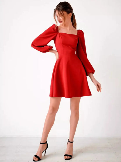 Stunning red mini dress with puff sleeves and square neckline, perfect for party dresses and special occasions.