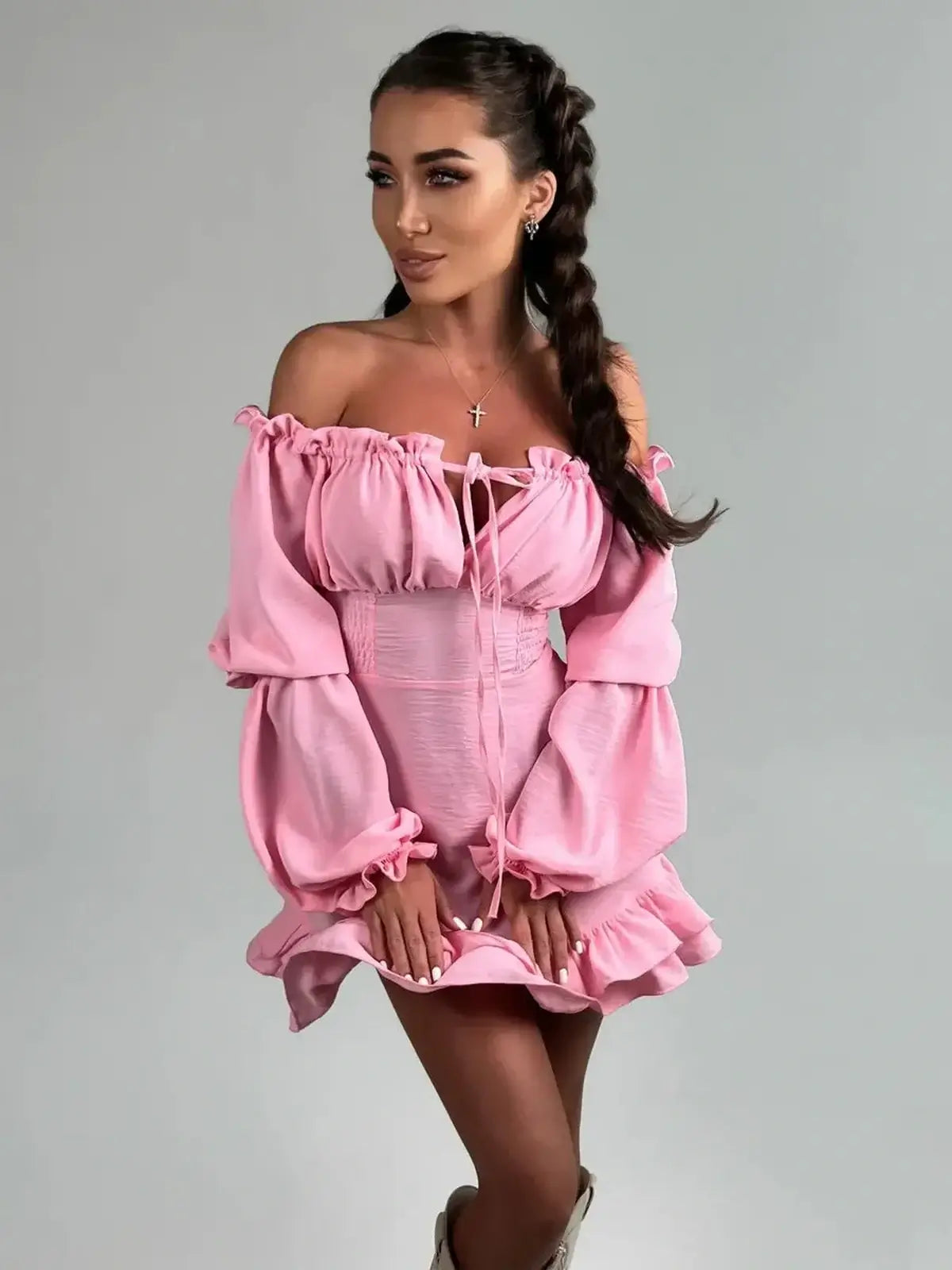 Pink off-shoulder mini dress with long lantern sleeves and gathered cuffs, perfect for summer events or weddings.