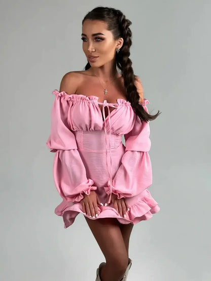 Pink off-shoulder mini dress with long lantern sleeves and gathered cuffs, perfect for summer events or weddings.