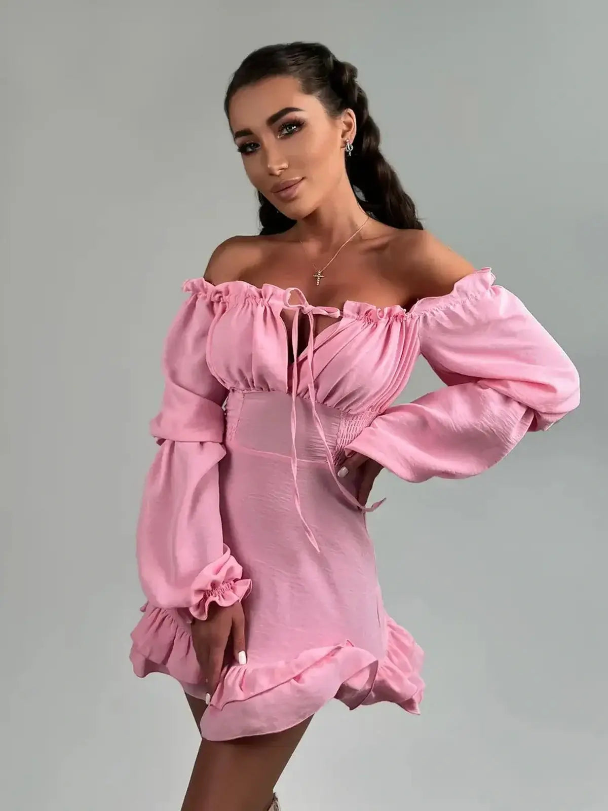 Ruffle Muse pink off-shoulder mini dress with lantern sleeves and flouncy hemline, perfect for weddings and parties.