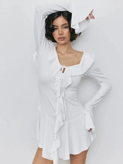 Model wearing a white mini dress with ruffles, perfect for summer, weddings, and parties.