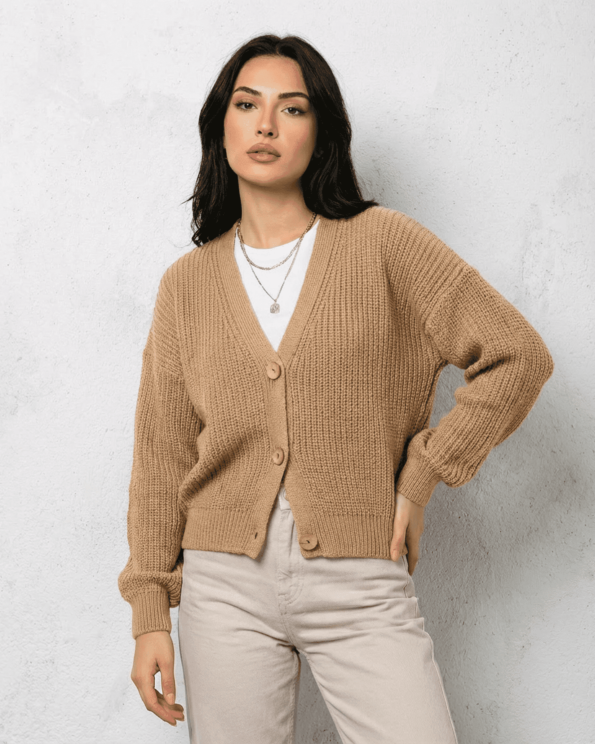 Saffron Cardigan by Slimona, elegant beige knitwear with a relaxed V-neck and loose fit for effortless layering.