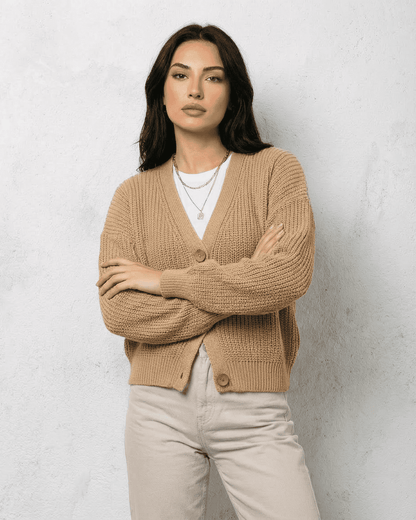 Saffron Cardigan by Slimona, elegant beige knitwear featuring a relaxed V-neck and long sleeves.