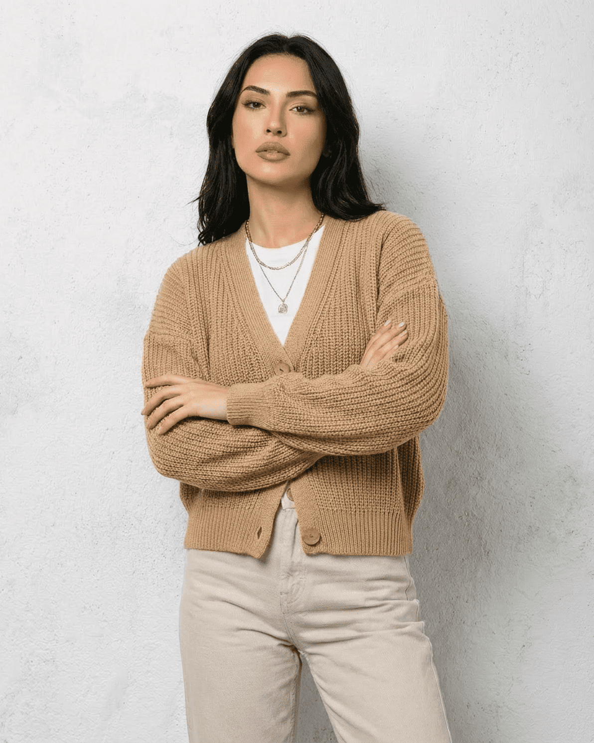 Saffron Cardigan by Slimona, elegant beige knitwear with a relaxed V-neck silhouette and long sleeves.