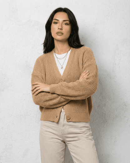 Saffron Cardigan by Slimona, elegant beige knitwear with a relaxed V-neck silhouette and long sleeves.