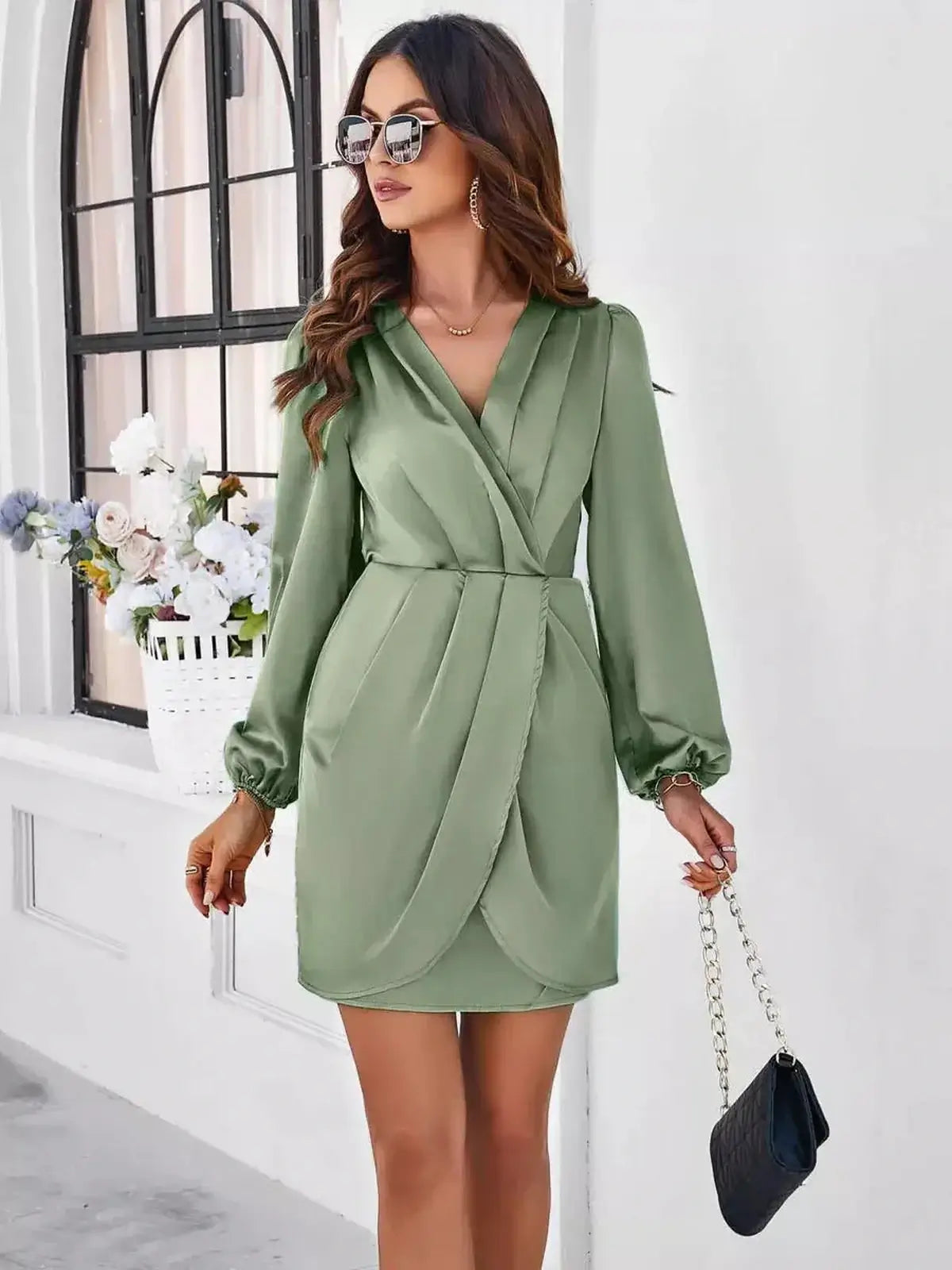 Elegant green satin wrap mini dress with V-neckline, perfect for wedding guest, prom, or evening occasions.