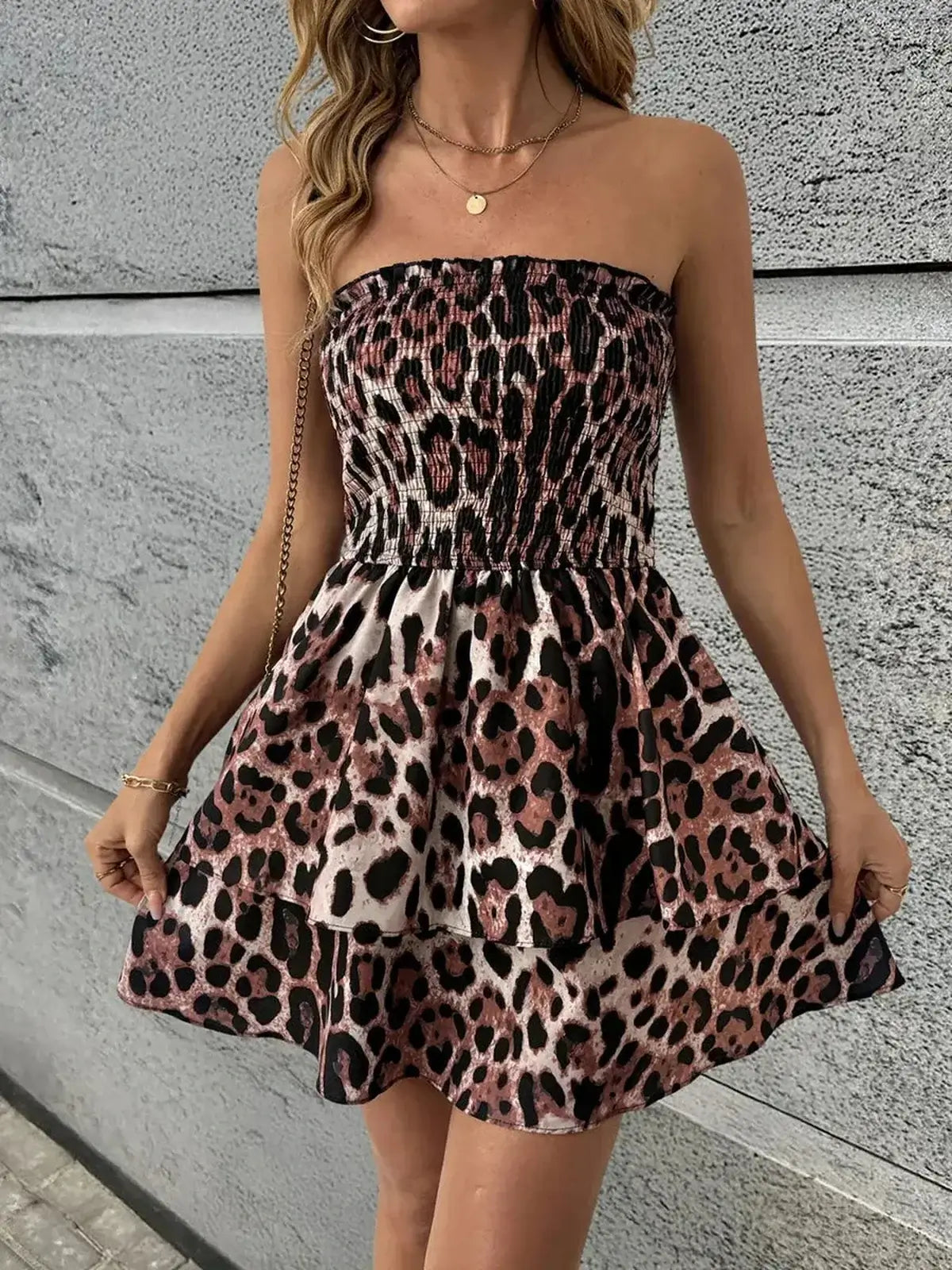 Strapless Savage Mood Mini Dress in bold leopard print, featuring a smocked bodice and layered ruffle skirt for summer.