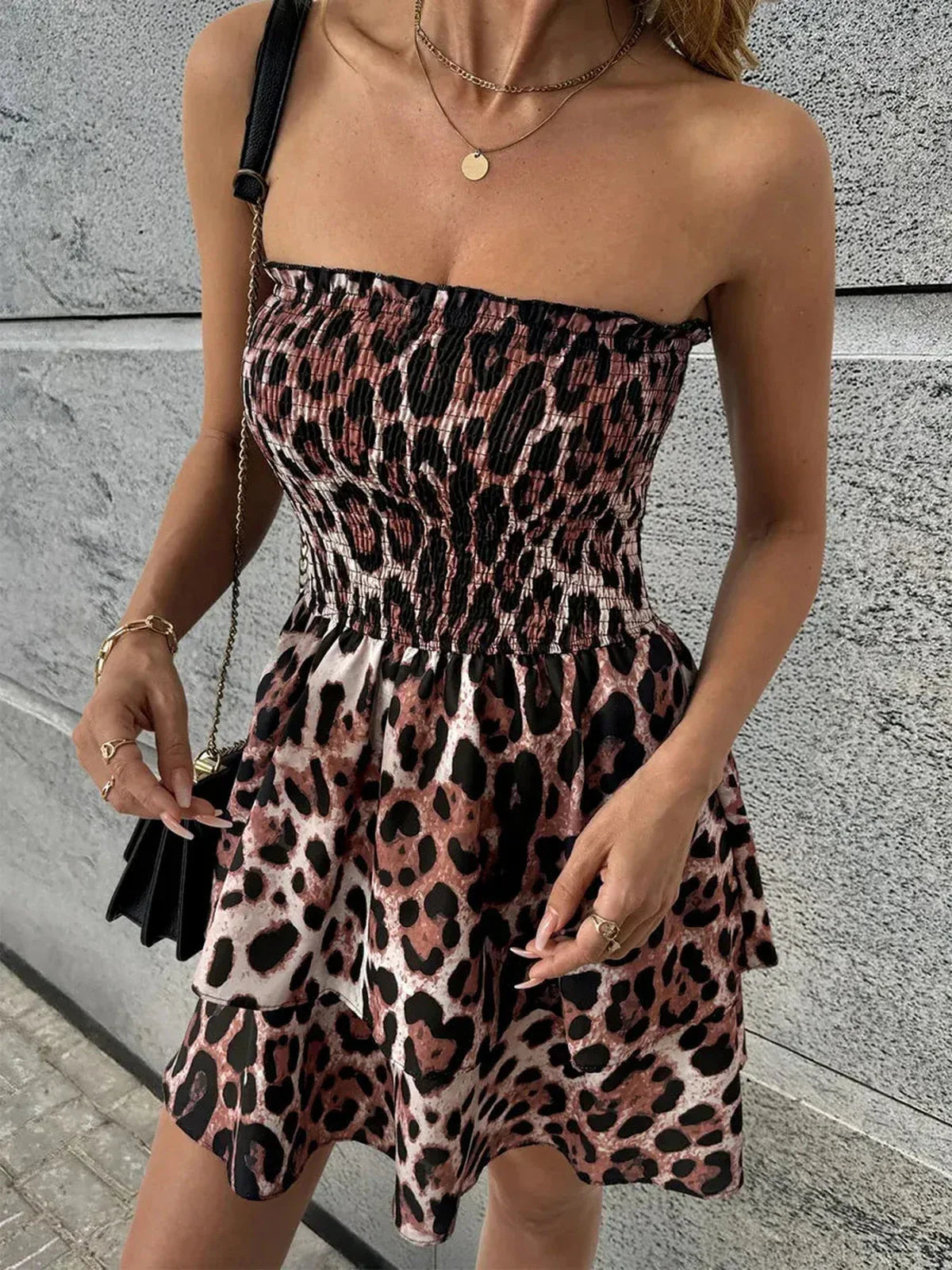 Savage Mood Mini Dress in bold leopard print with smocked bodice, perfect for summer outings and parties.