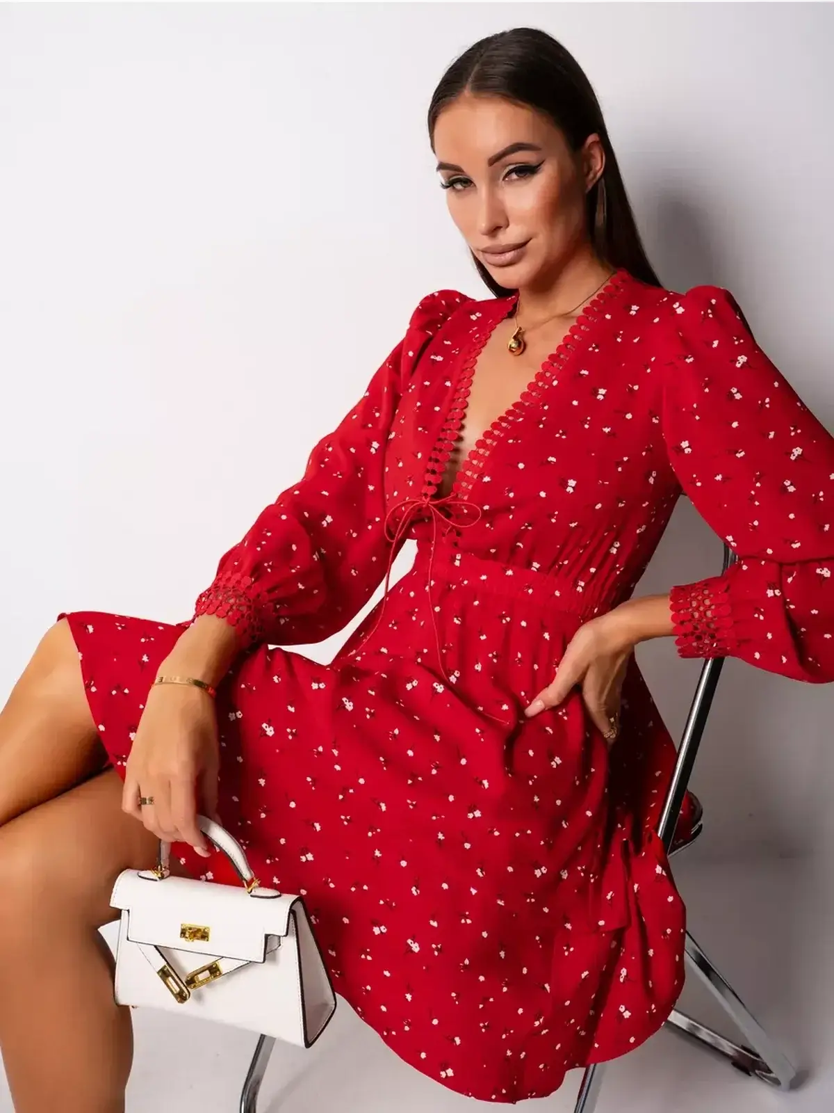 Bold red dress with a deep V-neckline and puff sleeves, perfect for weddings, parties, and summer events.