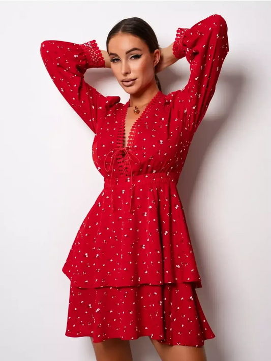 Model showcasing the bold red Scarlet Bloom mini dress with lace trim and puff sleeves, perfect for summer and party occasions.