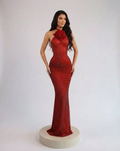Scarlet Maxi Dress by Slimona, featuring a halter neck and floral detail in a stunning red shimmer.