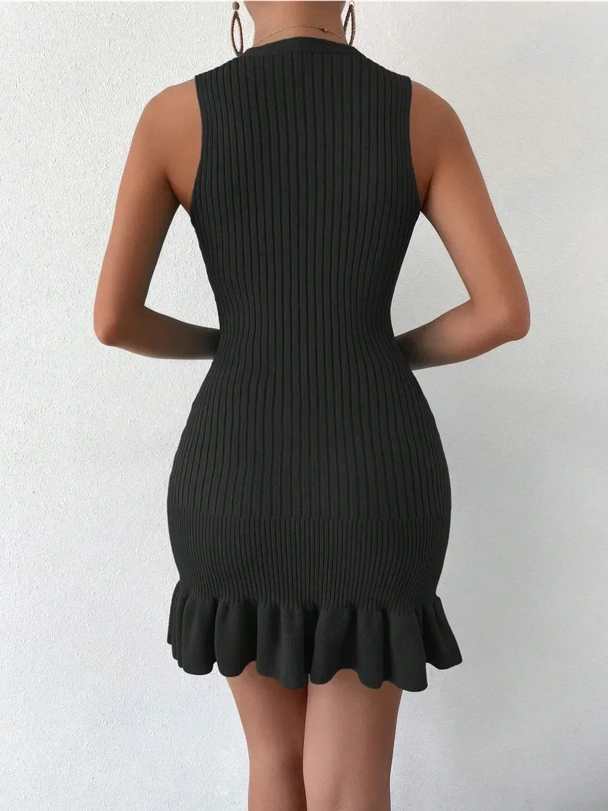 Black ribbed mini dress with flared hem, perfect for summer and special occasions.