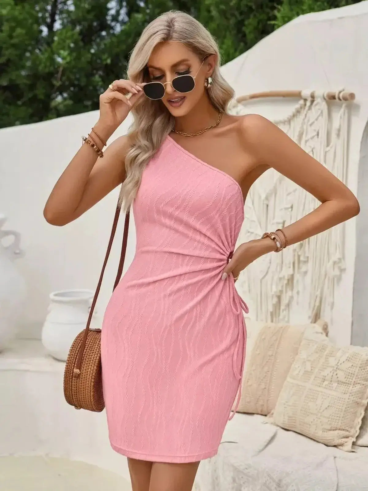 Stylish pink Sculpted One Mini Dress with a one-shoulder silhouette, perfect for summer parties and casual outings.