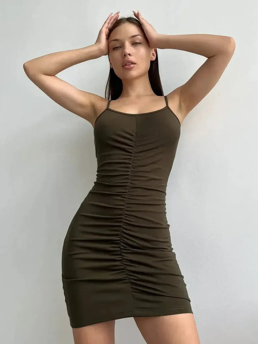Sleek olive green mini dress with ruched detailing for a perfect silhouette, ideal for summer and party occasions.