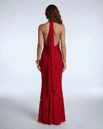 Seraphina Maxi Dress by Slimona - Back view of a red jacquard mermaid gown with dramatic ribbon tie detail.