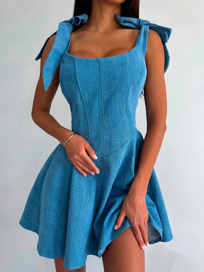 Sky Bow Corset dress in soft blue with self-tie bow straps, perfect for wedding guest, bridesmaid, and summer occasions.