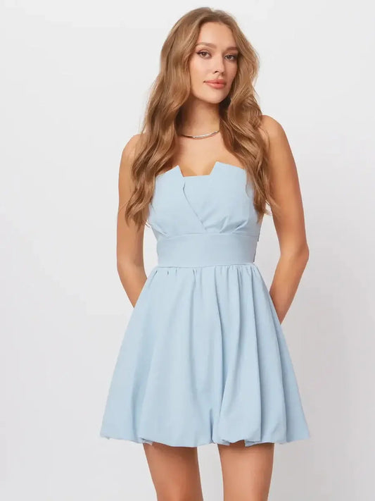 Skye Mini Dress in soft pastel blue, featuring A-line silhouette and playful open-back design, perfect for summer occasions.