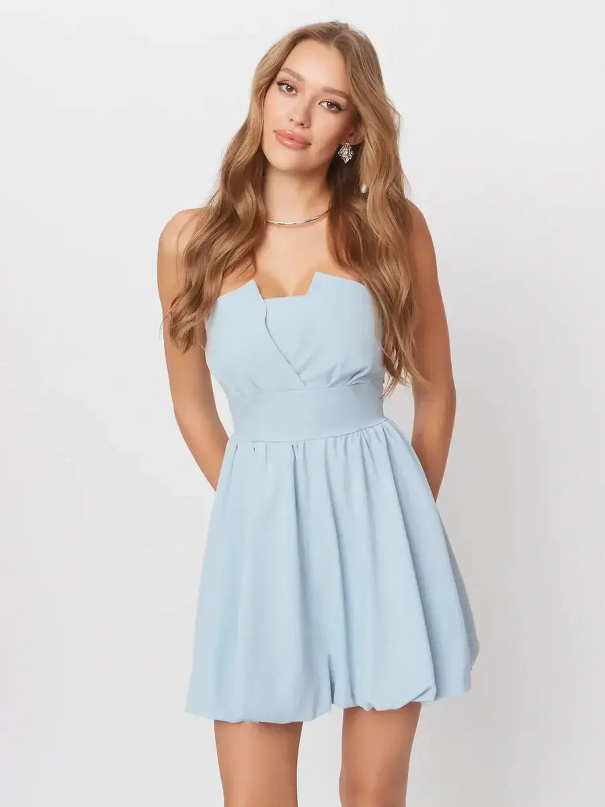 Skye Mini Dress in soft pastel blue featuring a flattering A-line silhouette and playful open-back design.
