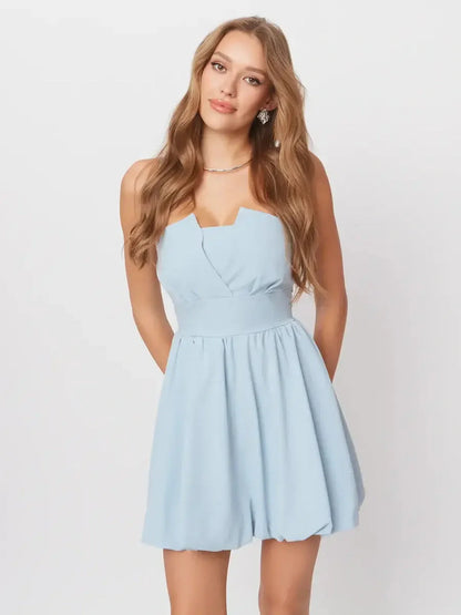 Skye Mini Dress in soft pastel blue featuring a flattering A-line silhouette and playful open-back design.