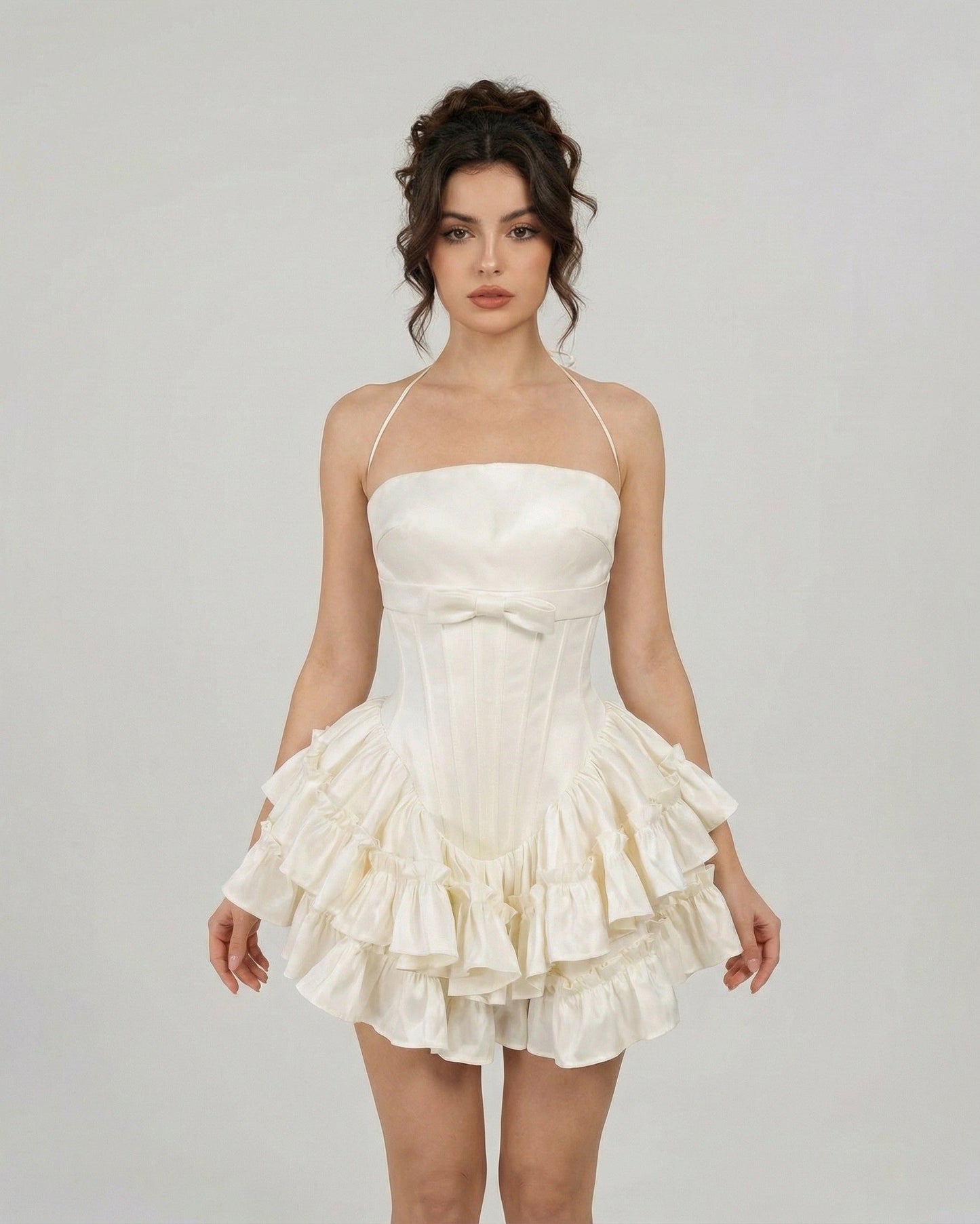 Celeste Mini Dress by Slimona - Elegant corset-inspired tiered mini dress in soft white with halter straps.