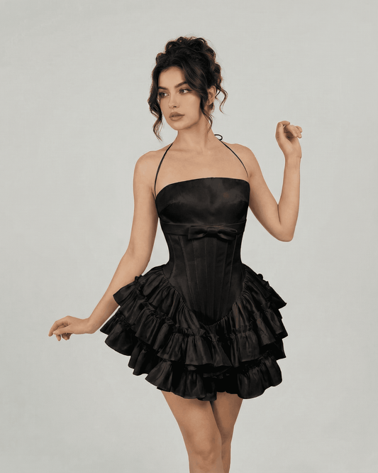 Slimona Noir Mini Dress featuring a corset-inspired bodice and tiered skirt in classic black.