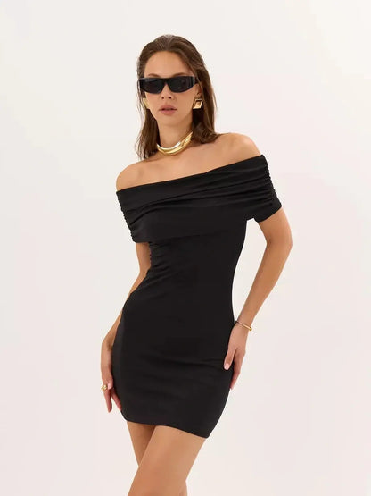Elegant black bodycon mini dress with off-shoulder neckline and ruched detailing, perfect for summer parties.