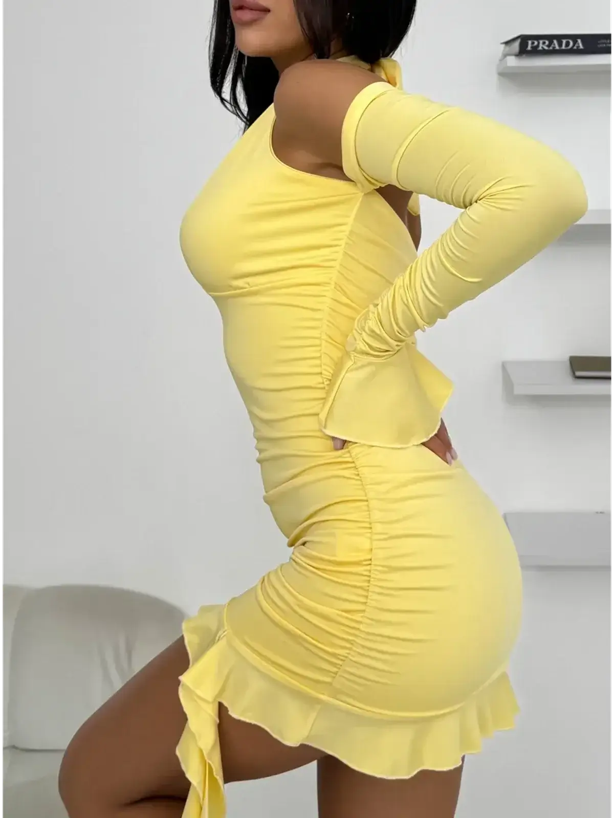 Yellow mini dress with ruffle hem and off-shoulder sleeves, perfect for summer cocktail parties and special occasions.