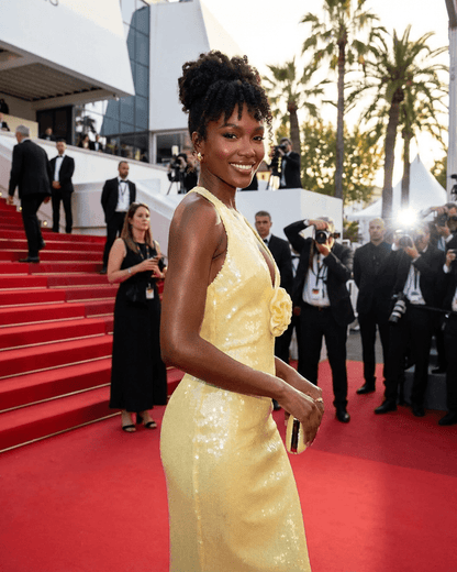 Solara Maxi Dress by Slimona, featuring a backless design with floral sequin details at a glamorous event.