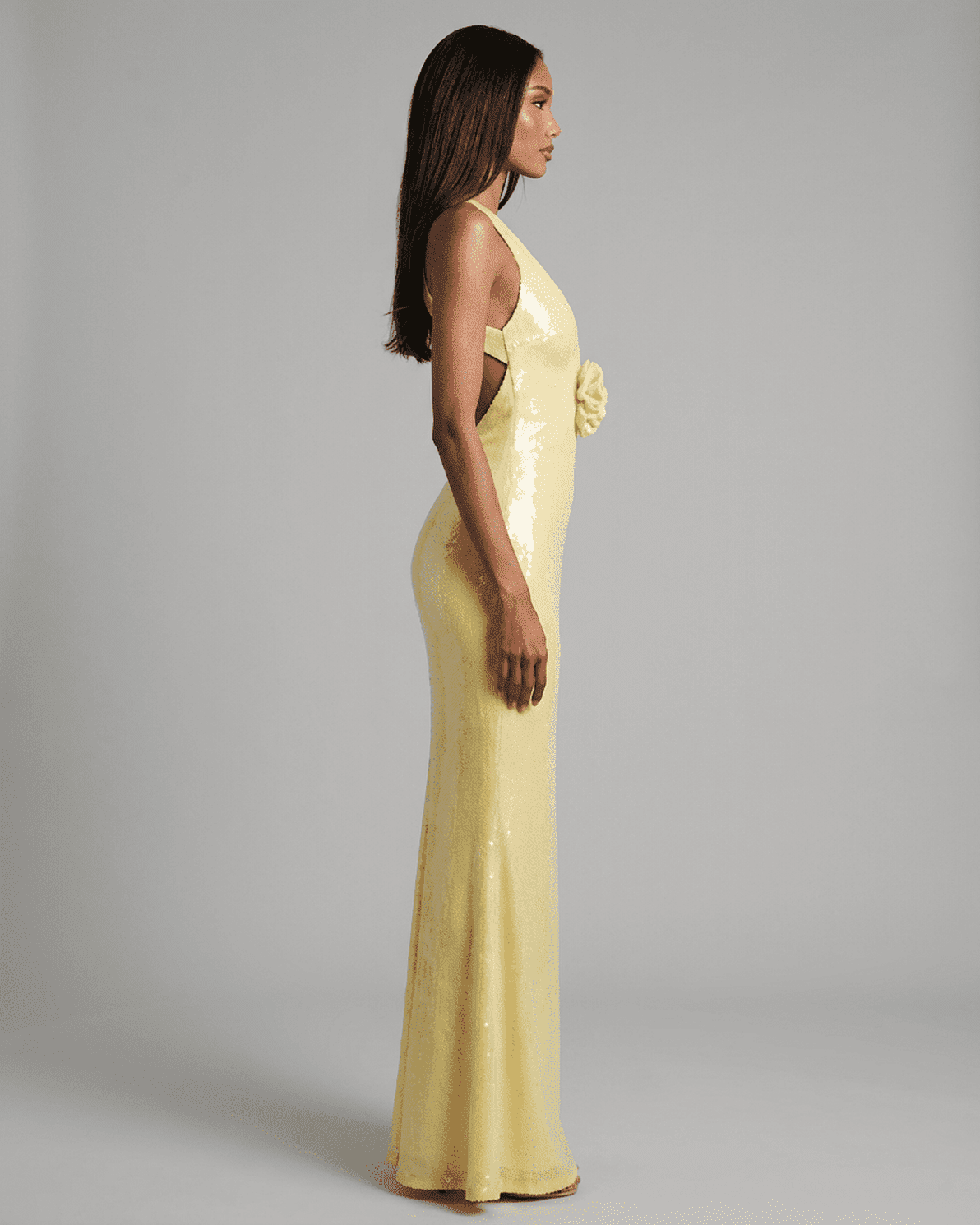 Solara Maxi Dress by Slimona in yellow with backless V-neck silhouette and floral sequin detail.