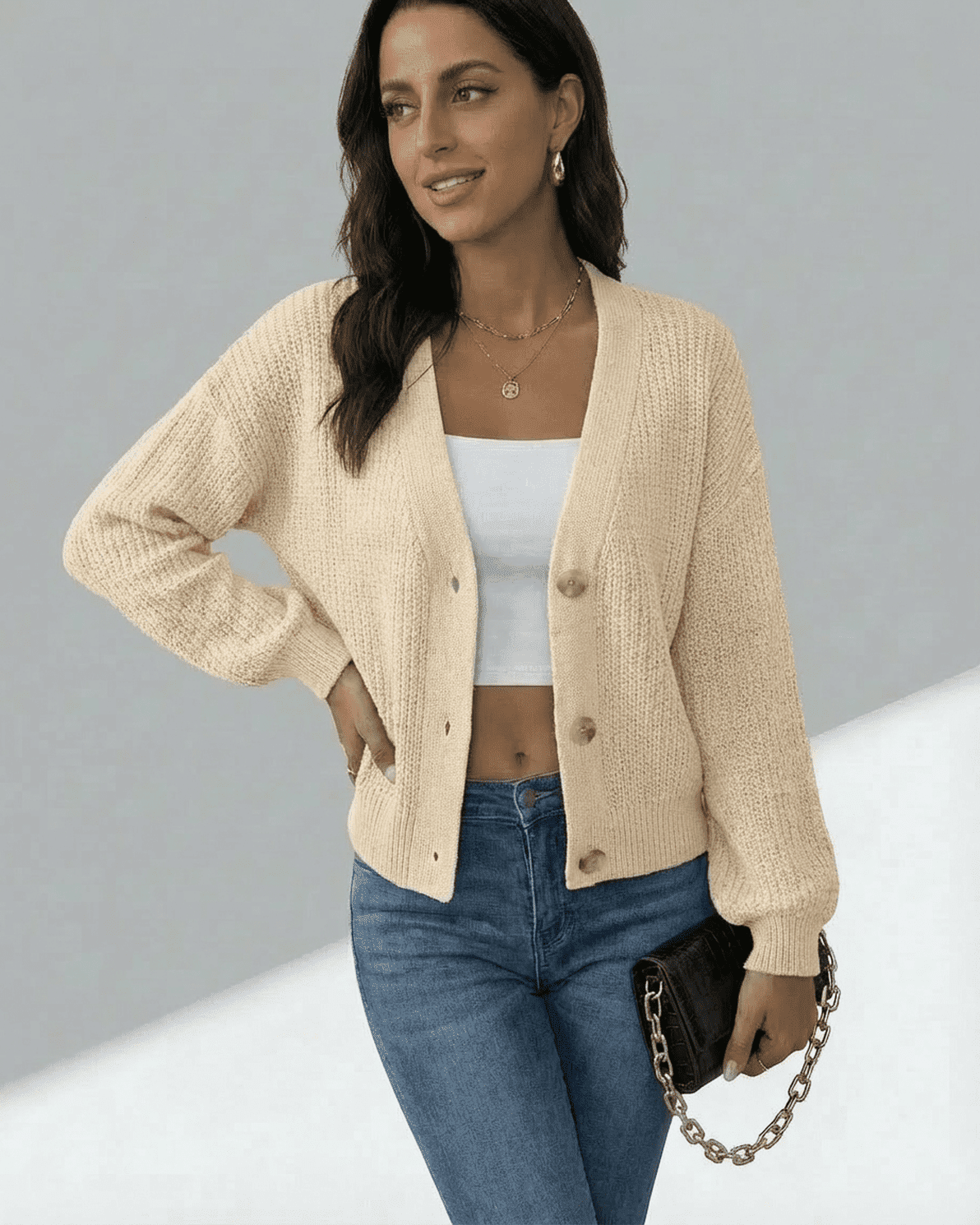 Model wearing Slimona Solene Cardigan in beige, featuring a button-front design and classic V-neckline.